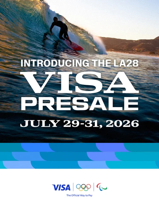 A graphic announcing the LA28 Visa Presale. It features a striking photo of a surfer on a large wave at sunset. The text reads: 'Introducing the LA28 Visa Presale, July 29-31, 2026.' The bottom of the image includes logos for Visa, the Olympic Games, and the Paralympic Games.
