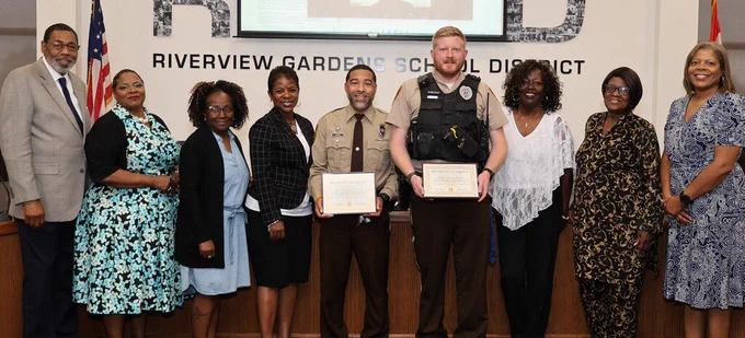 Riverview Excellence Award presented to SROs Randal Dennis and Ryan Richter at May 26 BOE meeting. 
