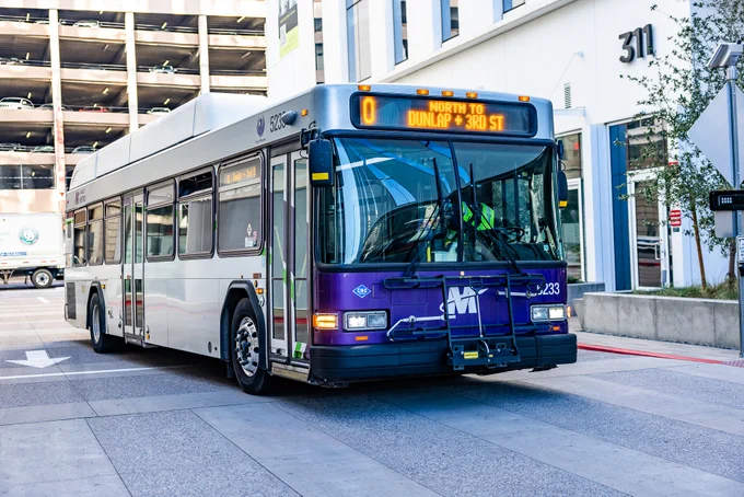 A purple City of Phoenix bus pulling into Central Station in Downtown Phoenix. 
