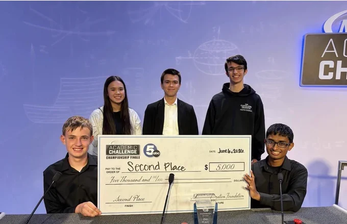 BBHHS 2026 Academic Challenge Team members holding $5,000 check