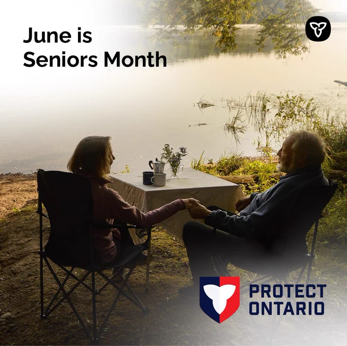 Two older adults sitting at a lakefront campsite. Text reads: June is Seniors Month.
