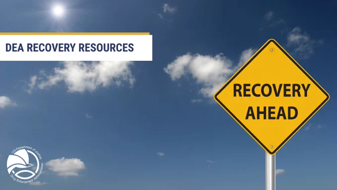Yellow road sign reading 'Recovery Ahead' against a blue sky with scattered clouds and DEA Recovery Resources text overlay.