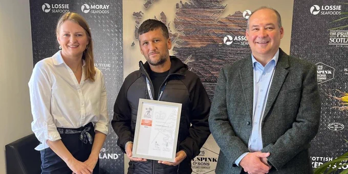 Associated Seafoods' Arbroath Operations Manager holding the Employer Recognition Scheme Bronze Award between Highland RFCA’s Defence Relationship Manager and Associated Seafoods' Group Head of HR.