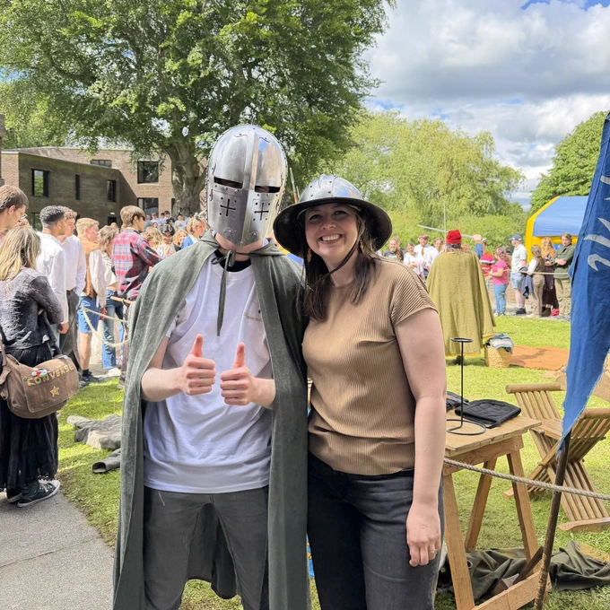 The JCR President and Assistant Principal wearing helmets
