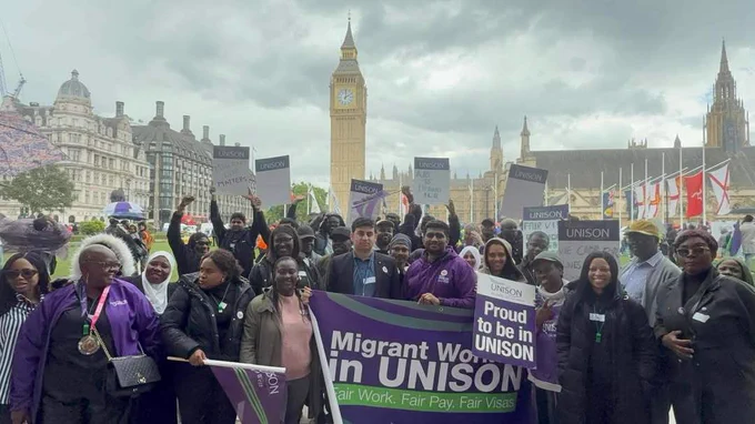 Care workers with banner - migrant workers in UNISON - outside Parliament, London. Photo: UNISON North West