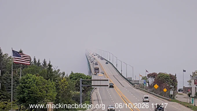 Bridge disappears into fog.