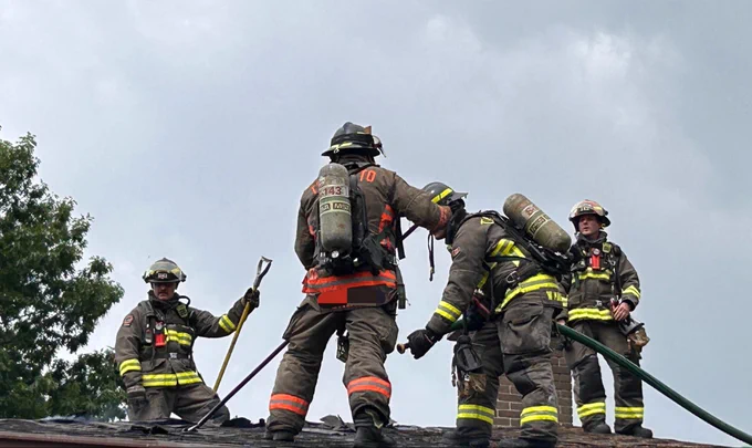 Fire crews on roof.