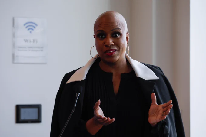 A woman speaking and gesturing.