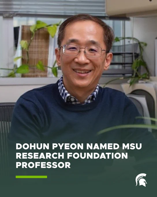 A square graphic featuring a portrait of a person seated indoors, wearing glasses and a dark sweater over a checkered shirt, with office shelves and green plants in the background. Overlaid text reads, “DOHUN PYEON NAMED MSU RESEARCH FOUNDATION PROFESSOR.” A green accent bar appears beneath the text, and the Michigan State University Spartan helmet logo is positioned in the lower right corner.