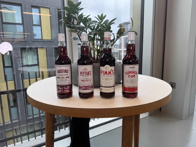 A bottle of Pimm's and three own-brand alternatives from major UK supermarkets.