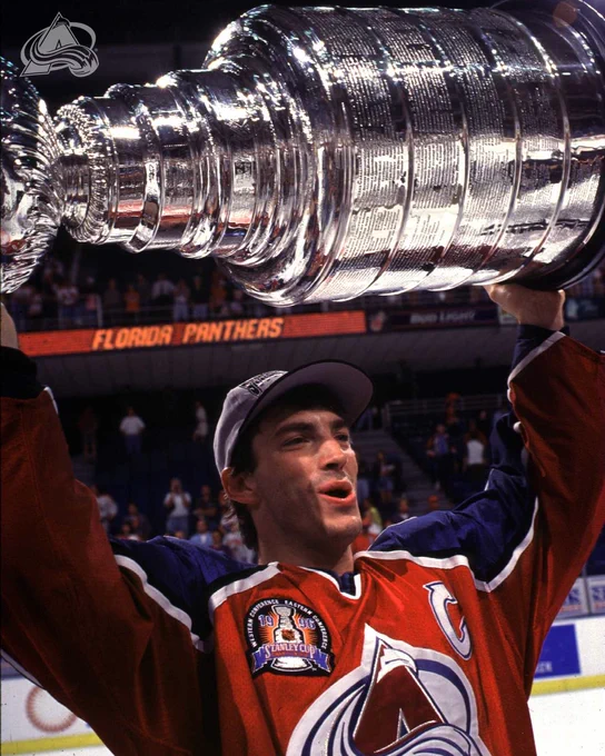 Joe Sakic hoisting the 1996 Stanley Cup over his head