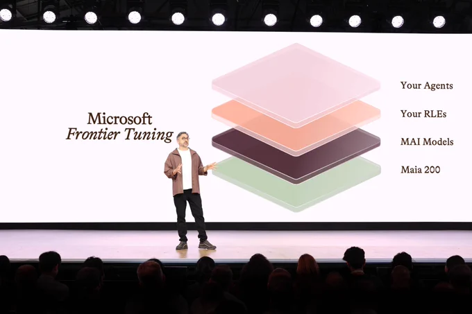 A speaker stands on stage in front of an audience, presenting on Microsoft Frontier Tuning. The screen displays stacked layers with text: 'Your Agents', 'Your RLEs', 'MAI Models', and 'Maia 200'.