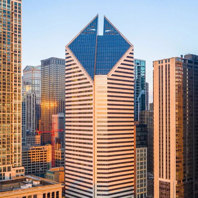 a picture of the building from a distance showing its distinctive diagonally cut roof