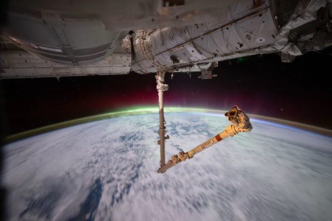 The aurora australis crowns Earth’s atmosphere above the Indian Ocean as the Canadarm2 robotic arm extends from a power and data grapple fixture attached to the Harmony module.

Photo: NASA/Chris Williams
