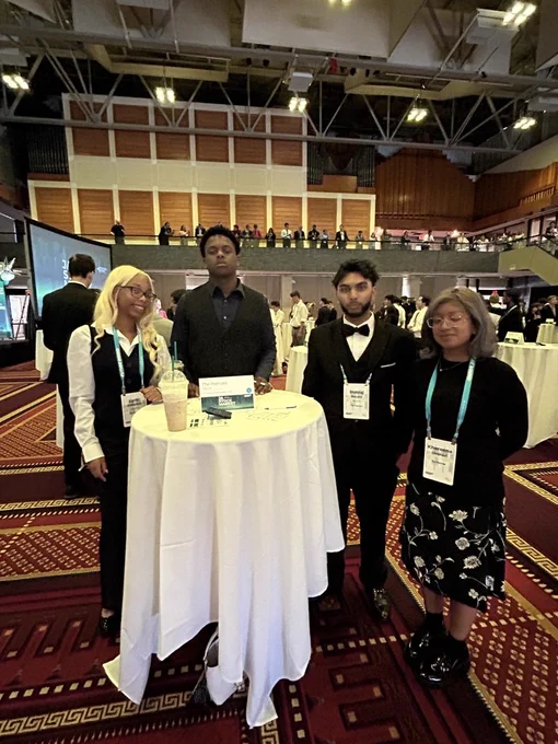 Photo:  Four Students competing in the National JA Stock Market Competition in Boston