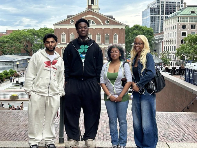 Photo:  Four Students competing in the National JA Stock Market Competition in Boston