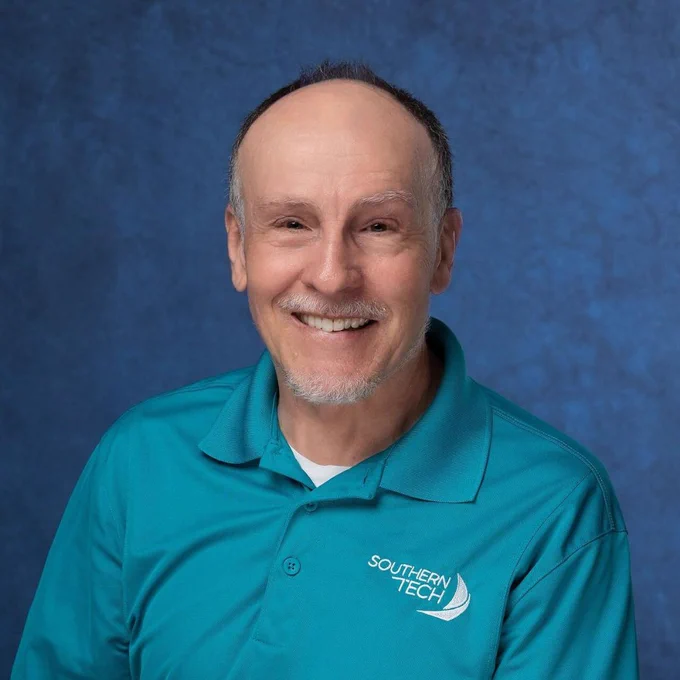 employee smiling at the camera