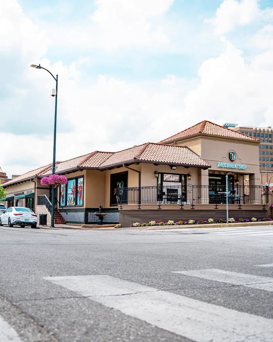 Wide shot of the Current Shop on the Plaza