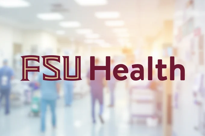 The words 'FSU Health' in garnet and gold text centered over a brightly lit, blurred background of a hospital corridor with medical staff in scrubs.