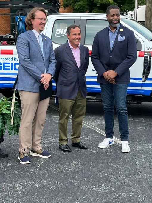 Georgia DOT and GEICO representatives celebrate the announcement.