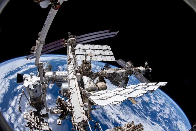 NASA photo shows the International Space Station with earth in the background.