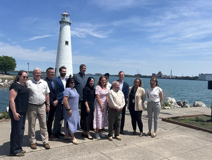 Group standing next at Detroit River Area of Concern event.