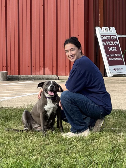 Student Volunteer Sydney at volunteer event with shelter dog.