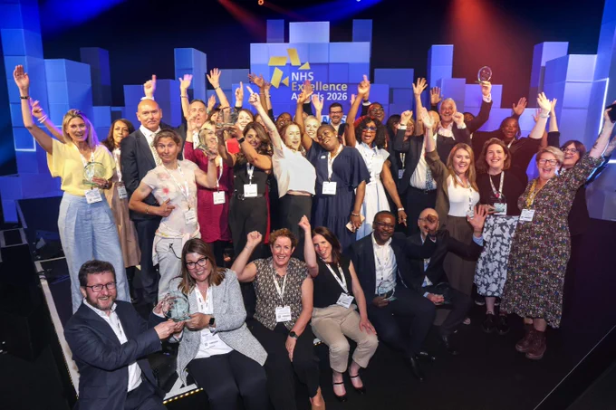 Cheerful group of diverse NHS staff celebrating together on stage at the NHS Excellence Awards 2026.