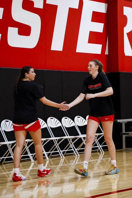 Mafalda Fontan and Ellery Minch high five