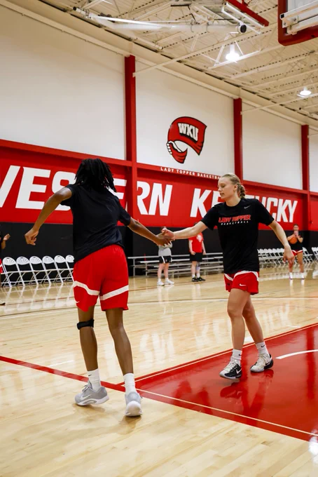 Torri James and Enni Ahervuo high five