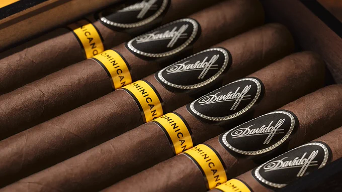 A box containing several Davidoff cigars, each wrapped with a band labeled "Puro Dominicano". - Cigars International