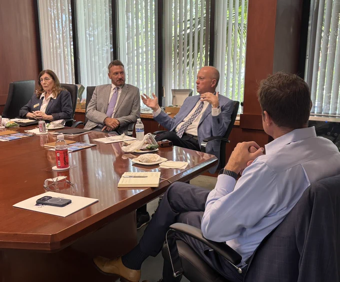Drs. Jeffery Allbritten and Judith Bilsky are joined by Jason Dudley in a large boardroom to speak with the Florida Trend Editorial board. 