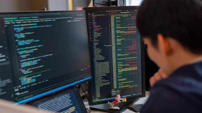 Andrew Kim looks at data on a computer screen