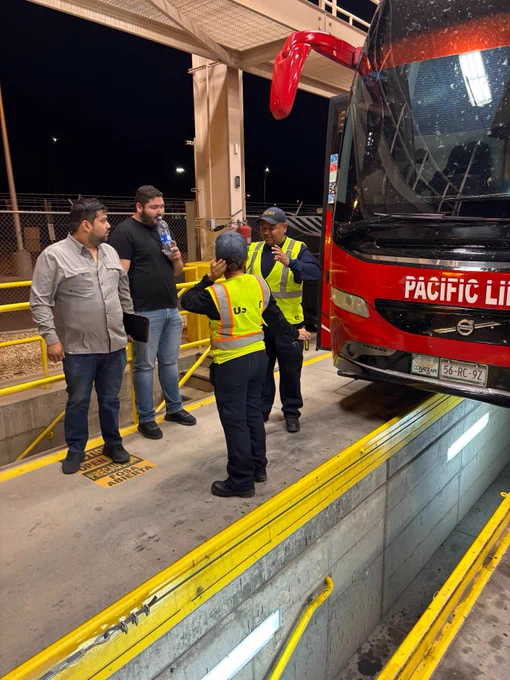 FMCSA safety inspecctors speak with motorcoach drivers. 