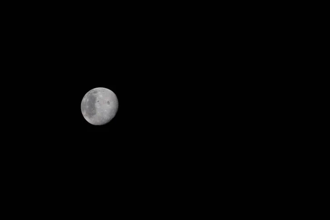 This photo of the Moon was captured by the Artemis II crew aboard the Orion spacecraft a few hours before the lunar flyby on April 6, 2026. During the flyby, the crew captured critical science observations as they traveled around the far side of the Moon, traveling farther than any humans ever before. The Moon resembles a gray cratered orb in the distance, standing out against the blackness of space. Credit: NASA