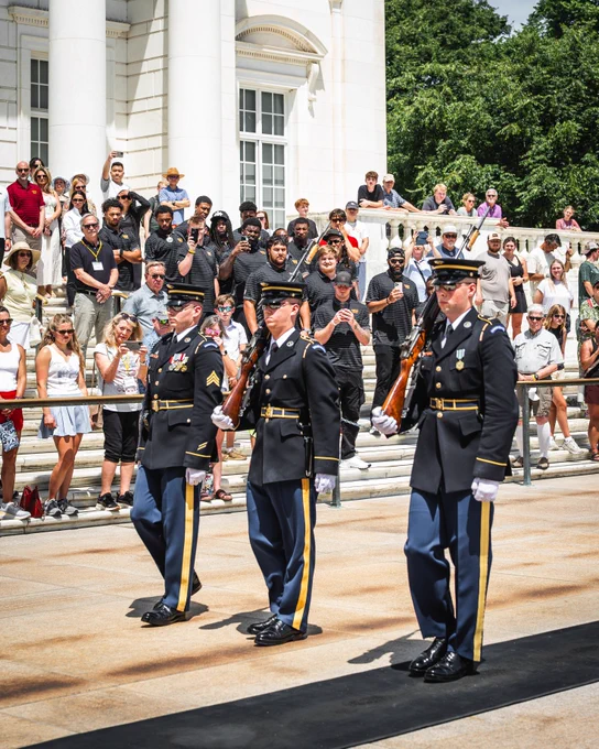 Photo of the Commanders 2026 rookie class at Arlington National Cemetery. They are witnessing a changing of the guard at the Tomb of the Unknown Soldier.