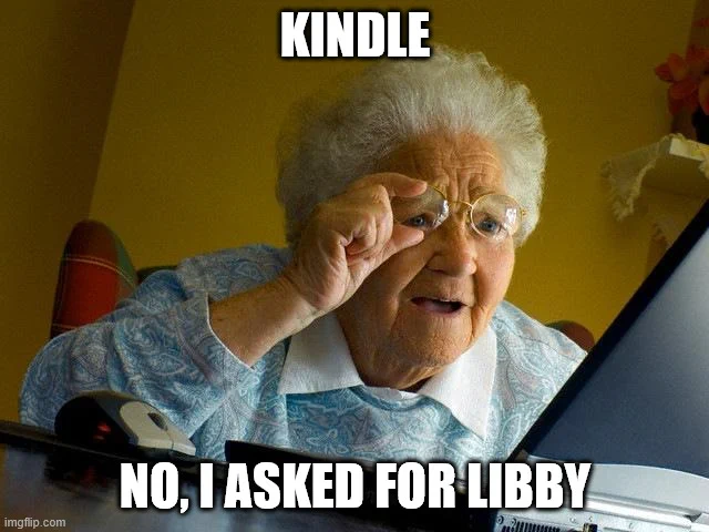 An elderly woman staring at a computer while holding her glasses. On top in white, "Kindle" On bottom in white, "No, I asked for Libby"