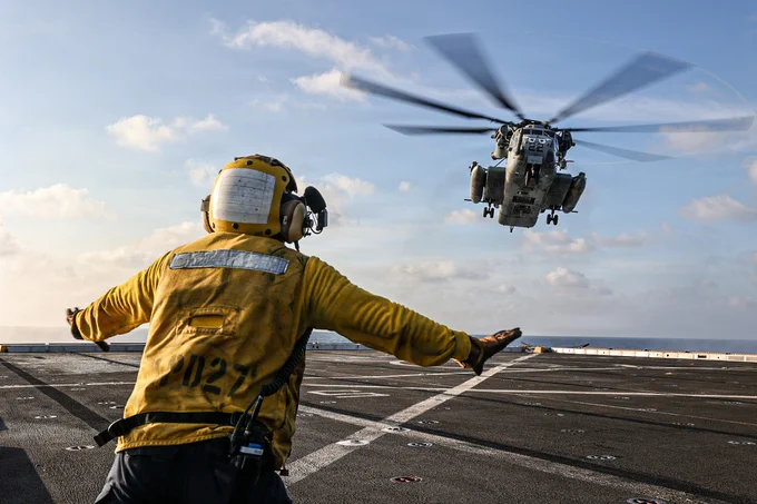 U.S. Navy Aviation Boatswain\u2019s Mate (Handling) 3rd Class Darrell Agustin assigned to San Antonio-class amphibious transport dock ship USS Portland (LPD 27), guides a CH-53E Super Stallion with Marine Medium Tiltrotor Squadron\u202F(VMM)\u202F163 (Reinforced), 11th Marine Expeditionary Unit, onto the flight deck in the South China Sea, June 6, 2026. The 11th MEU, embarked aboard the Boxer Amphibious Ready Group, is a persistent, combat credible force contributing to deterrence and crisis response in the U.S. 7th Fleet area of operations. U.S. 7th Fleet, the U.S. Navy's largest forward-deployed numbered fleet, routinely interacts and operates with allies and partners to preserve a free and open Indo-Pacific. (U.S. Marine Corps photo by Cpl. Avery Wayland)\n\n