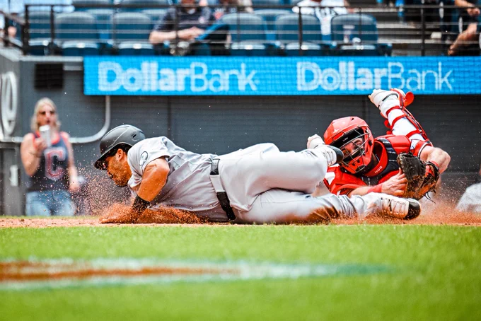 Trent Grisham slides home.