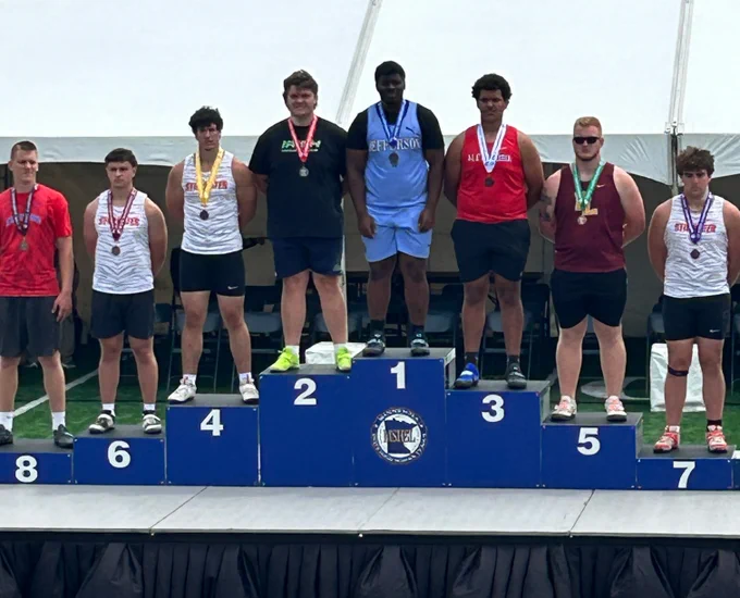 Photo of Michael Koleosho on podium