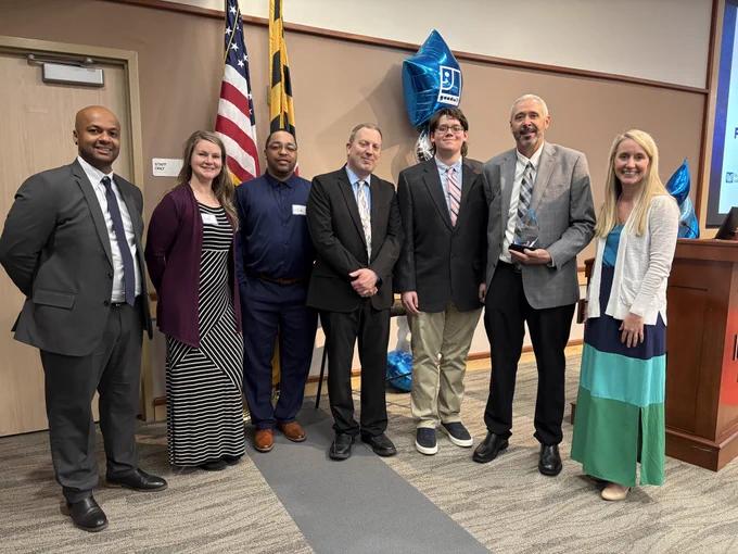 The Washington County Department of Social Services, including Kollin Murphy, is in the photo with Kollin accepting the Mission Advocacy Award at the 71st Annual Horizon Goodwill Power of Work Awards.