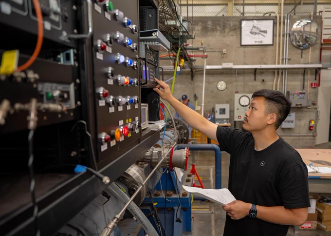 Ryan Chung inputs the gas mixture to be inserted in the tube as part of the test procedure at The Ames Electric Arc Shock Tube (EAST) facility.