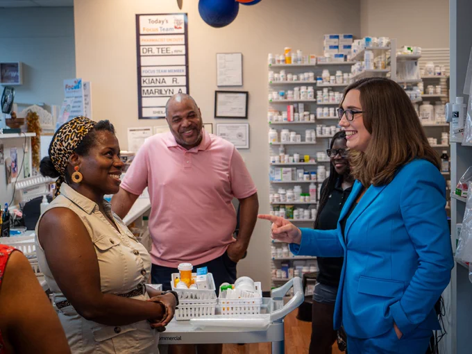 Rep. McBride speaks with a local pharmacist & small business owner in Delaware.