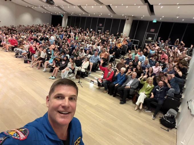 Jeremy in front of a crowd.