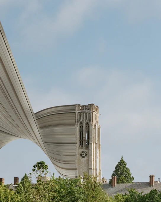 The image depicts a surreal scene with the University of Toledo's University Hall. The foreground includes trees and rooftops, with a clear blue sky in the background.