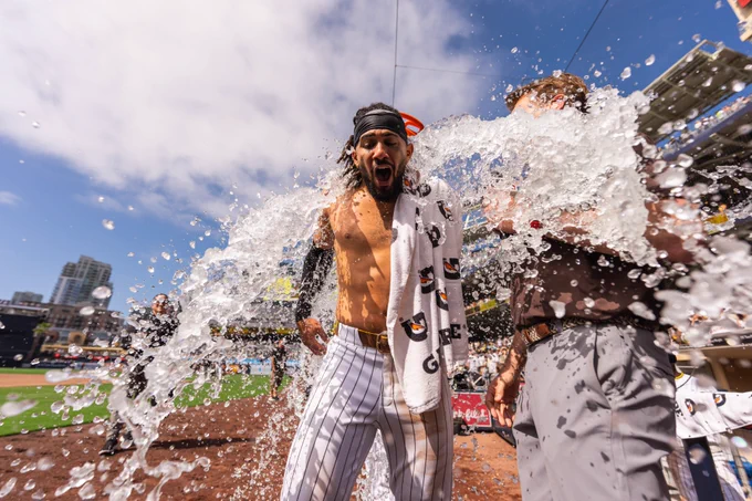 Photo of Fernando Tatis Jr. during his post-game interview. More Gatorade/ice is being poured on him.