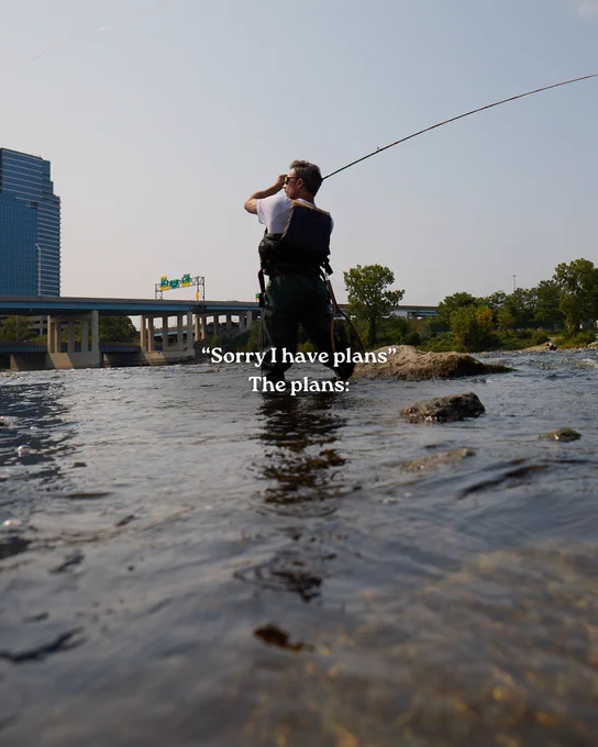 Person casting a fishing line while standing in a river near a bridge with overlay text reading Sorry I have plans. The plans.