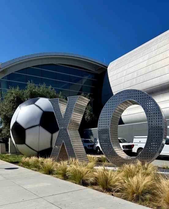 "XO" Statue with a giant inflatable soccer ball standing next to it at SJC