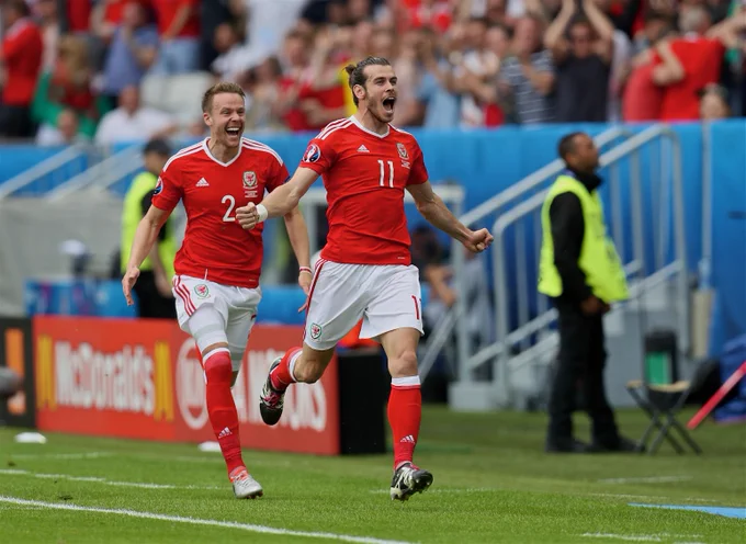 Gareth Bale celebrates scoring against Slovakia at EURO 2016.