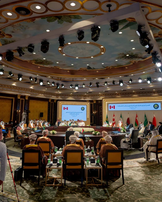 Gulf Cooperation Council meeting in a conference hall. 